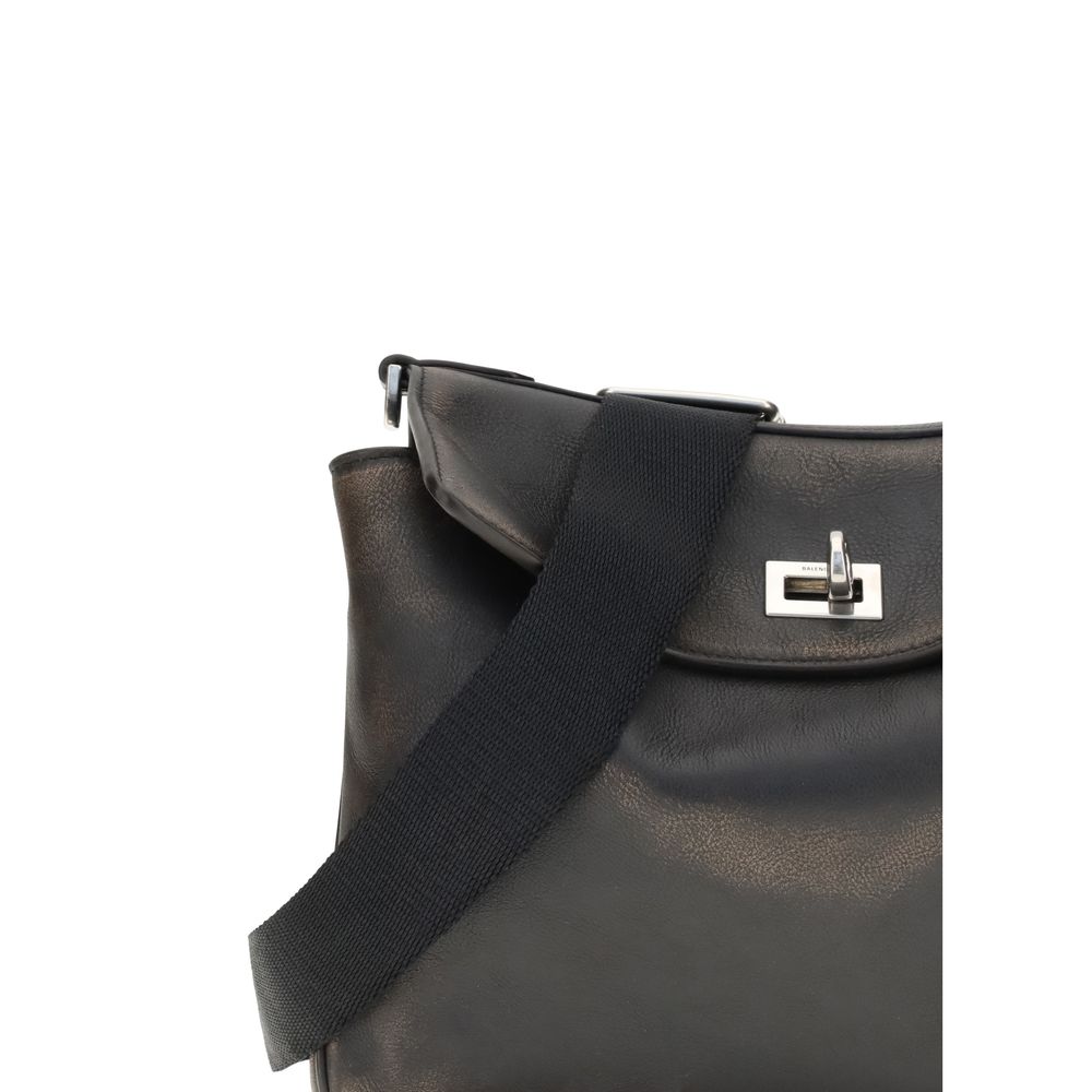 Close-up of Balenciaga Brown Lamb Ovis Aries Aries Shoulder Bag with car-belt-style strap and twist lock closure detail.