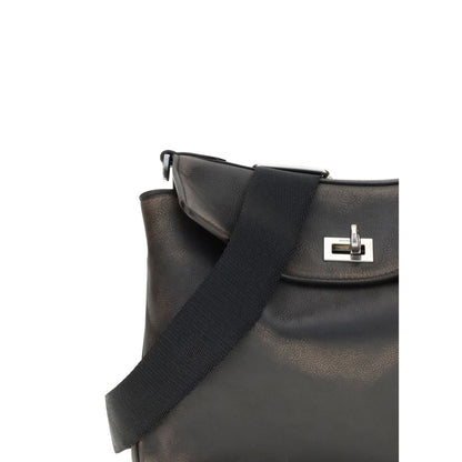 Close-up of Balenciaga Brown Lamb Ovis Aries Aries Shoulder Bag with car-belt-style strap and twist lock closure detail.