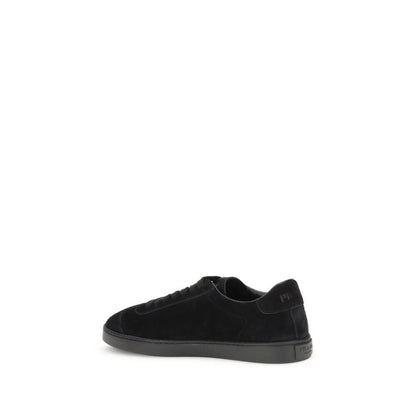 Prada Black Calf Leather Bos Taurus Low Top Sneakers with rubber sole, featuring iconic triangular plaque and tone-on-tone logo.