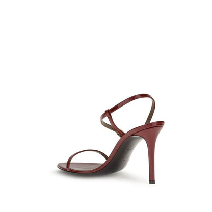 Side view of Giuseppe Zanotti Red Leather Stiletto Heel Sandals with thin straps and gold-tone buckles, highlighting a polished finish.