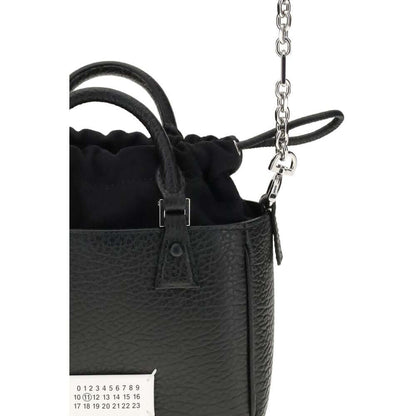 Margiela Black Calf Leather Bos Taurus Shoulder Bag with metal rivets and hand-painted edges, showing detail of the chain strap.