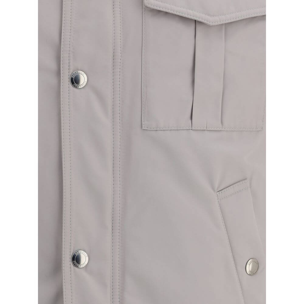 Detail view of Brunello Cucinelli White Polyamide Coat with snap-button closure and welt pockets.