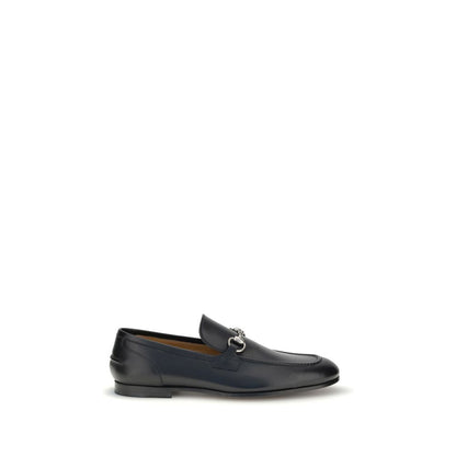 Gucci Black Calf Leather Bos Taurus Slip-On Loafers with metallic Morsetto detail, round toe, and elegant silhouette for formal and casual wear.