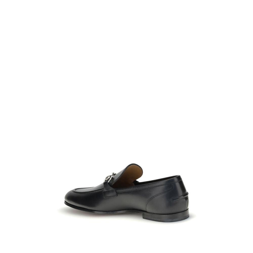 Gucci Black Calf Leather Bos Taurus Slip-On Loafers with iconic metallic Morsetto detail, round toe, and elegant silhouette.