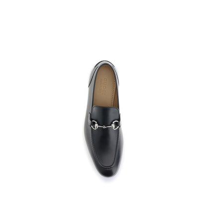 Gucci Black Calf Leather Bos Taurus Slip-On Loafers with Morsetto detail, top view of elegant leather shoe for formal attire, AW25 season.