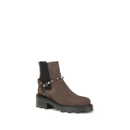 Valentino Garavani Brown Calf Leather Bos Taurus Chelsea Boots with studded strap and lug sole, perfect for bold, sophisticated style.
