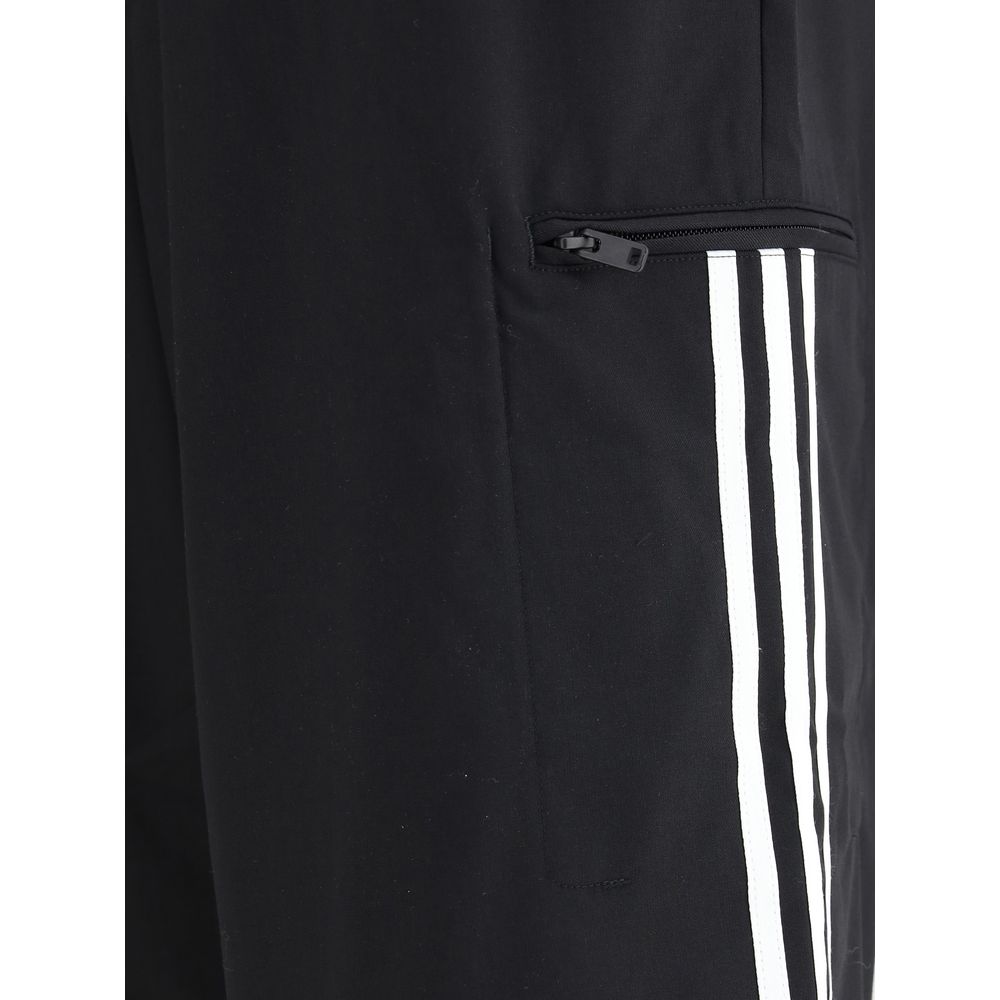 Close-up of Y-3 Black Wool Casual Pants featuring side zipper and vertical white stripes on black fabric.