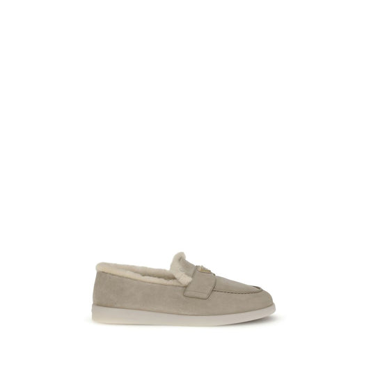 Prada Suede Loafers with fur lining, round toe, and logo plaque detail, made in Italy, AW25 collection.