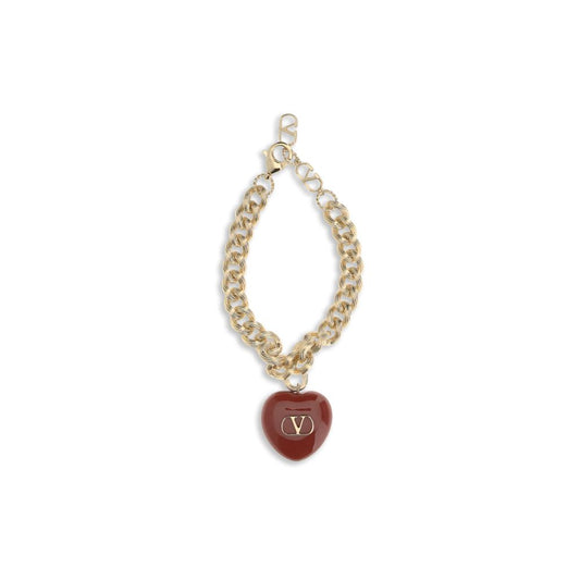 Valentino Garavani Gold Brass Bracelet with heart charm and VLogo, featuring elegant chain design and secure swivel lobster clasp.