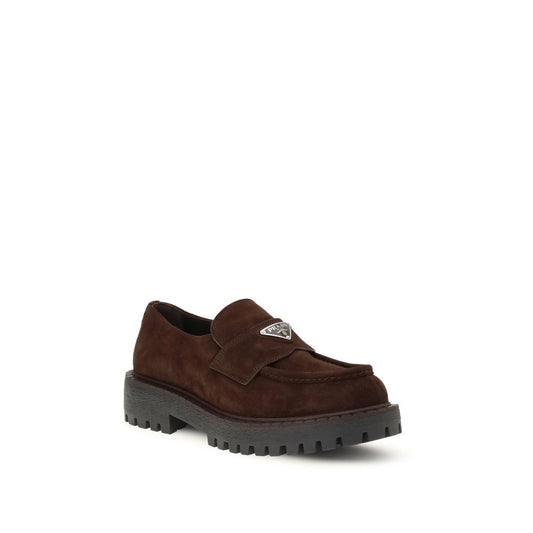 Prada Suede Loafers with triangle logo, rubber sole, elegant design for formal or casual wear, AW25 collection.