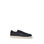 Prada Leather Sneakers with rubber sole, iconic triangular side plaque, round toe, and tone-on-tone logo. Made in Italy, AW25.