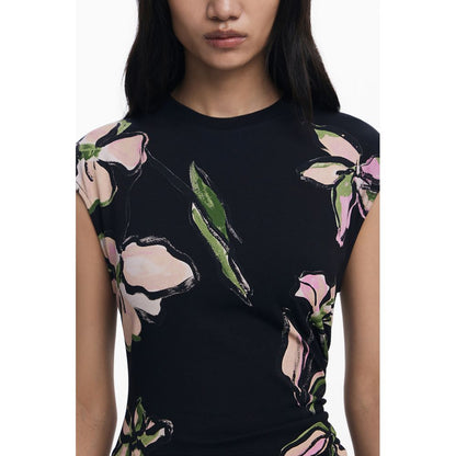 Model wearing Desigual Black Cotton Women Dress with floral print, short sleeves, and crew neck, showcasing modern fashion elegance.