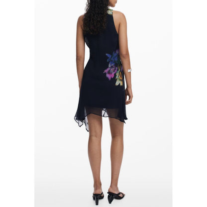 Back view of model wearing Desigual Black Polyester Women Dress with bold floral print and sleeveless design.
