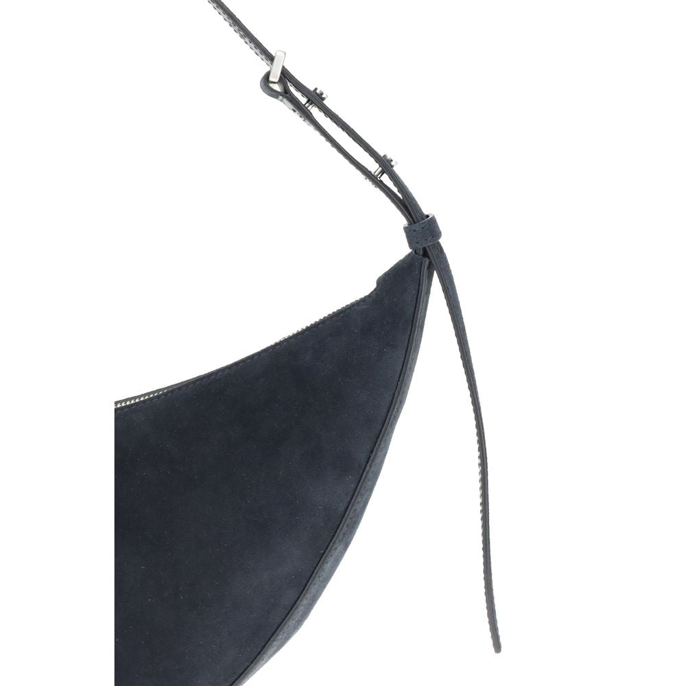 Close-up of Proenza Schouler Blue Lamb Ovis Aries Aries Shoulder Bag with adjustable strap and decorative studs.