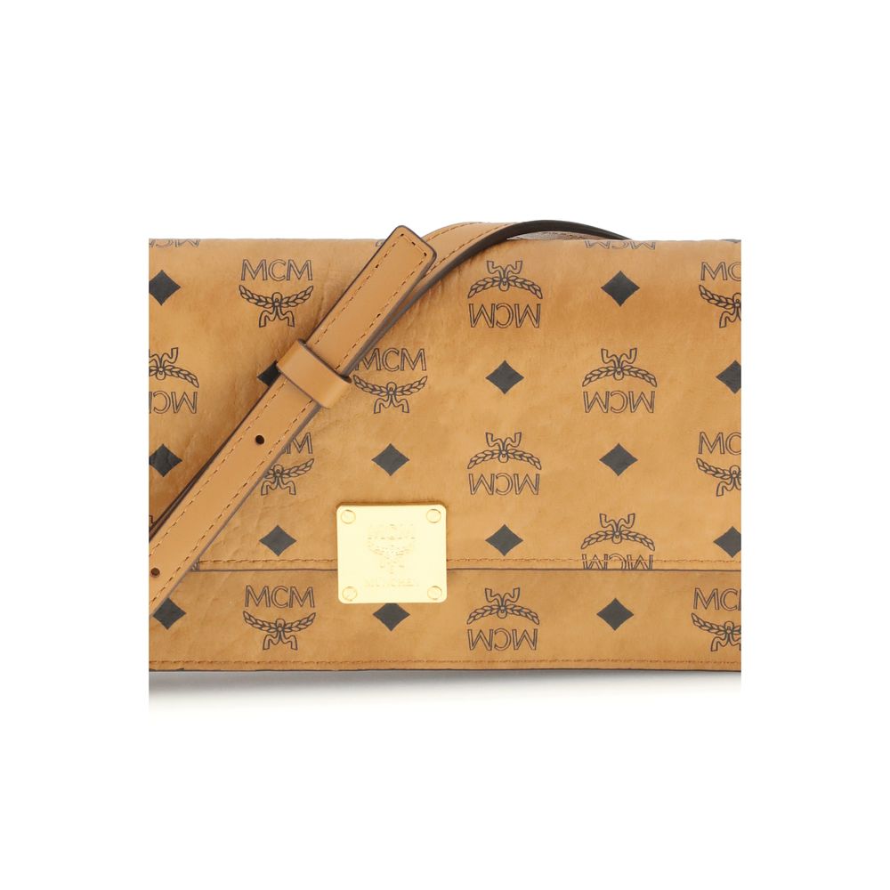 MCM Beige Fabric Wallet with Visetos pattern, metallic logo, leather strap, and magnetic closure. Features multiple pockets for AW25.