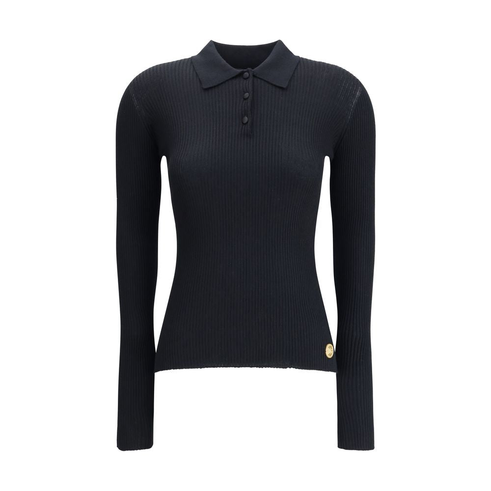 Dolce & Gabbana Black Cashmere Polo Shirt with ribbed design, classic collar, and three-button front for refined, versatile style.