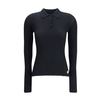 Dolce & Gabbana Black Cashmere Polo Shirt with ribbed design, classic collar, and three-button front for refined, versatile style.