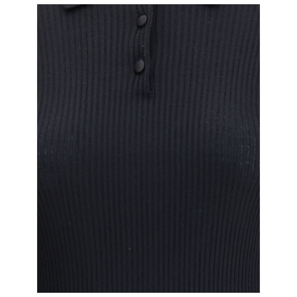 Dolce & Gabbana Black Cashmere Polo Shirt with ribbed texture and buttoned front, ideal for elegant and versatile styling, AW25 season.