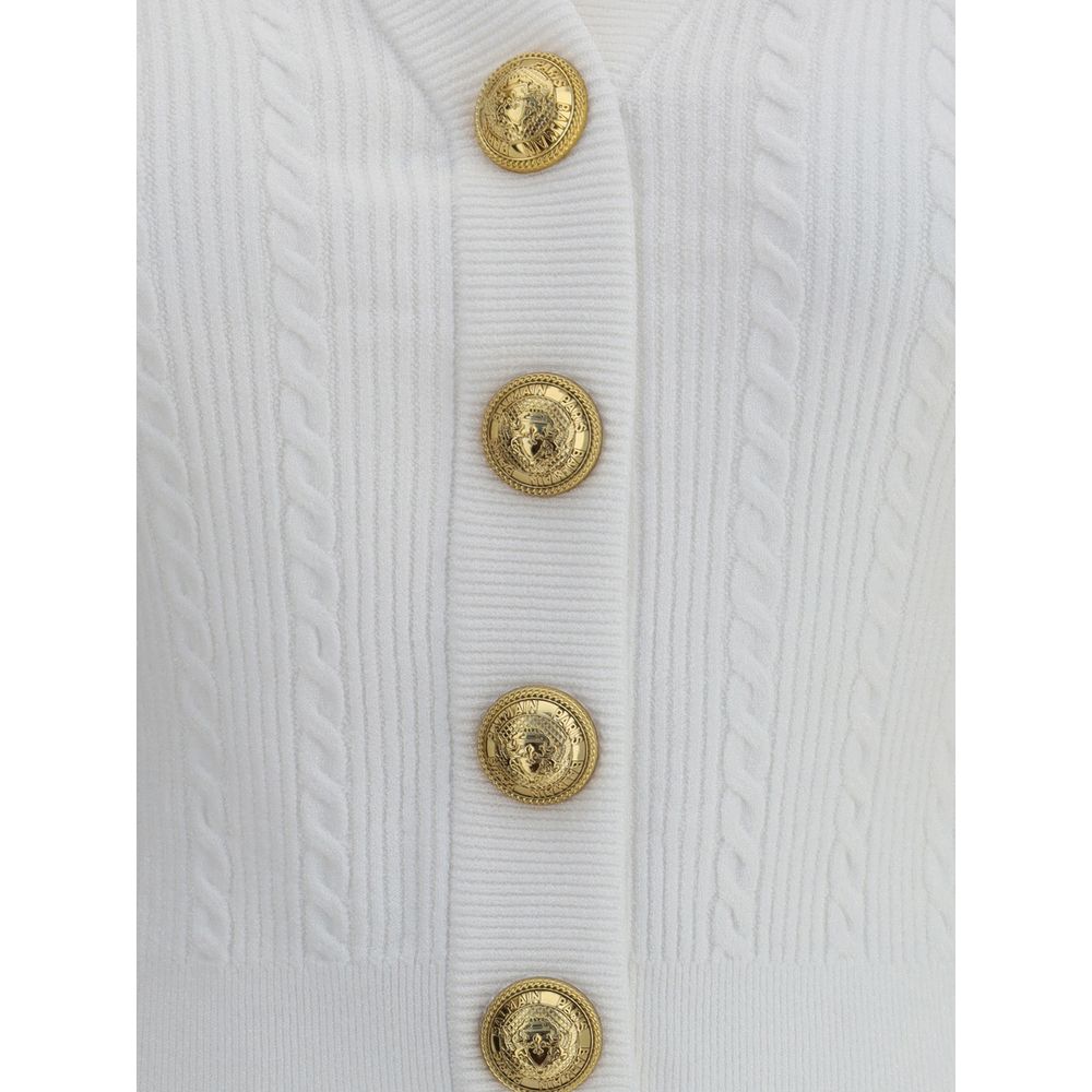 Balmain White Viscose Cardigan with embossed gold buttons and ribbed braiding, showcasing iconic structured design and military inspiration.