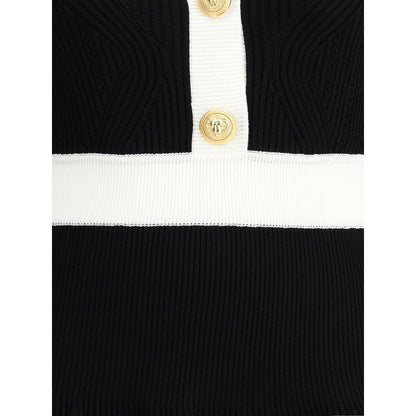 Close-up of Balmain Black Viscose Casual Dress with embossed buttons and ribbed knit detailing.