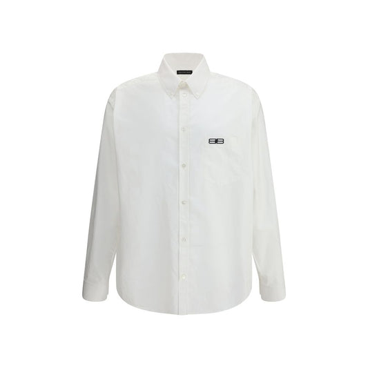 Balenciaga White Cotton Dress Shirt with classic collar and embroidered logo, featuring a front button closure and asymmetrical hem.