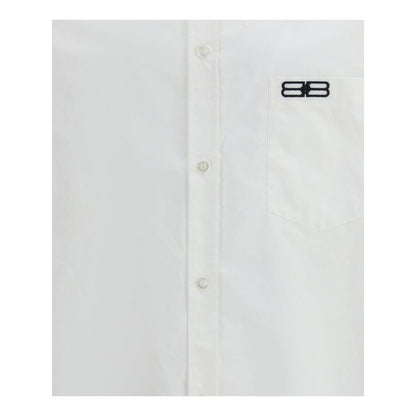 Balenciaga White Cotton Dress Shirt with classic collar, front button closure, asymmetrical hem, and embroidered logo on pocket.
