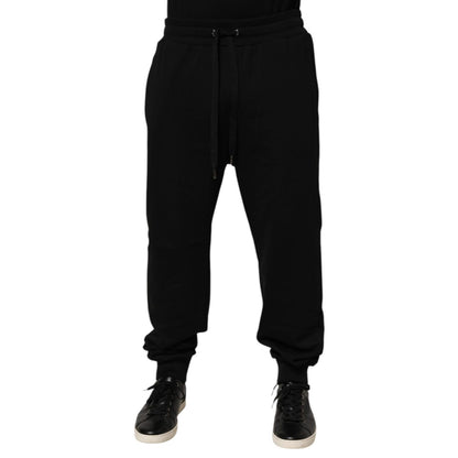 Dolce & Gabbana Black Cotton Drawstring Logo Sweatpants Pants, luxury casualwear joggers, stylish black design with logo patch.