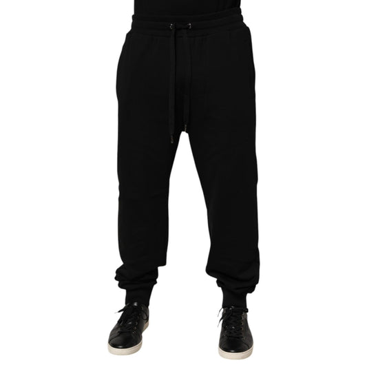 Dolce & Gabbana Black Cotton Drawstring Logo Sweatpants Pants with ribbed hems and adjustable waistband, featuring logo patch.