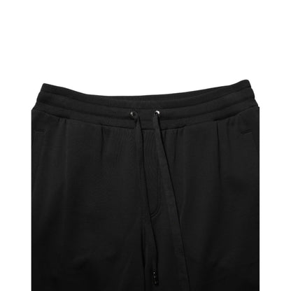 Dolce & Gabbana Black Cotton Drawstring Logo Sweatpants Pants with adjustable waistband and ribbed hems for luxury casualwear.