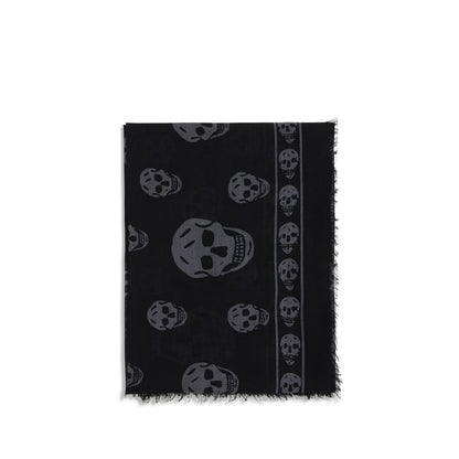 Alexander McQueen Black Modal Scarf with skull motif and fringed edges, made from silk and modal blend. Contemporary accessory for AW25.