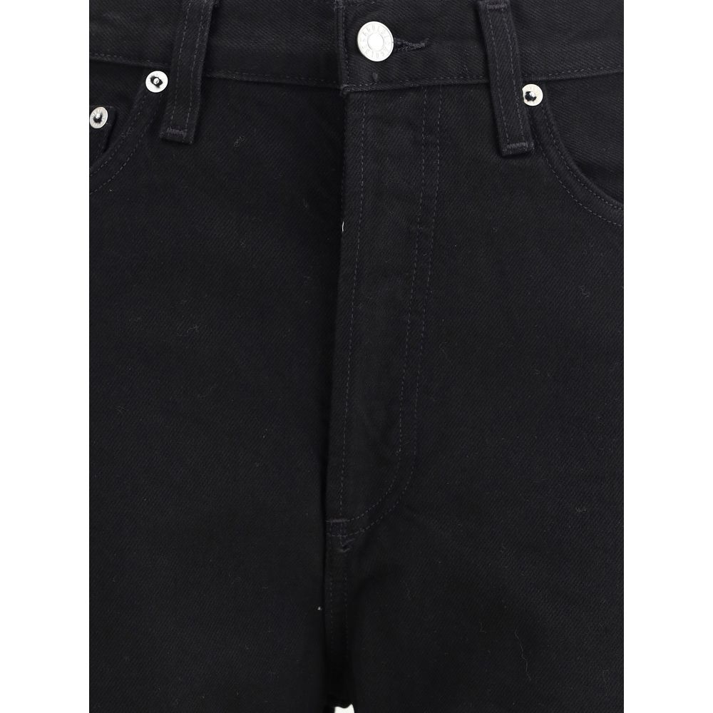 Close-up of Agolde Black Recycled Cotton High-Waisted Jean showcasing button detail and contoured leg in overdyed black denim.