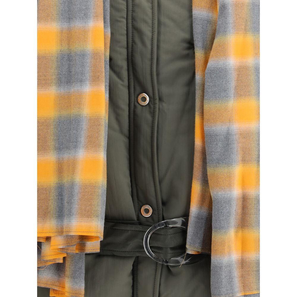 Close-up of MARBELL Green Polyamide Shell Jacket showing the quilted fabric, snap buttons, and orange plaid scarf for AW25 collection.