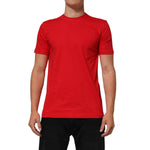 Model wearing Dolce & Gabbana Red Goodluck 2023 Cotton Crew Neck T-shirt, featuring a bold graphic and regular fit design.