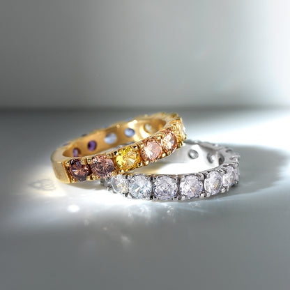 Luxury rings showcasing gemstones by AN JEWELS JEWELRY Mod. AL.RLOY1YF-8 in golden and silver hues, elegantly displayed in light.