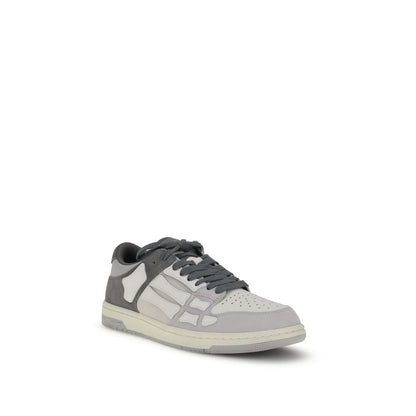 Amiri Gray Calf Leather Bos Taurus Low Top Sneakers with iconic bone appliqués and two-tone rubber sole, perfect for streetwear style.