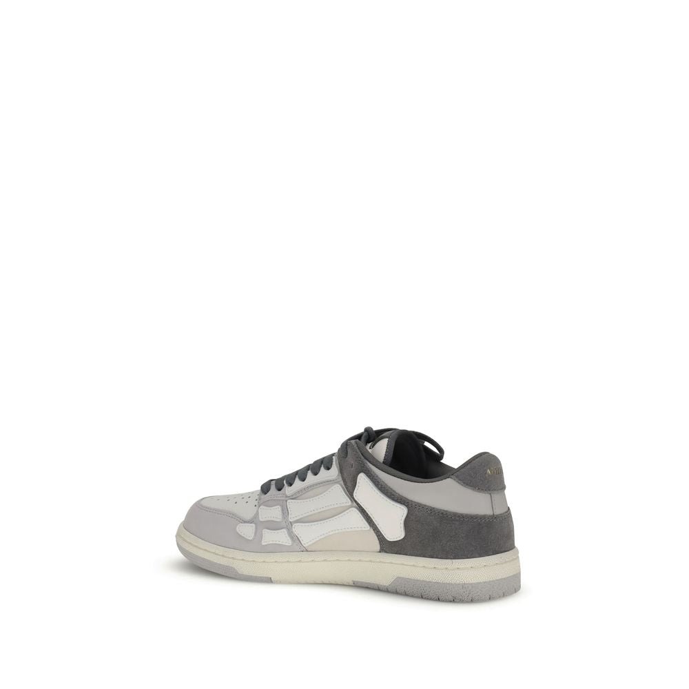 Amiri Gray Calf Leather Bos Taurus Low Top Sneakers with bone-shaped appliqués on a two-tone sole, showcasing streetwear style.