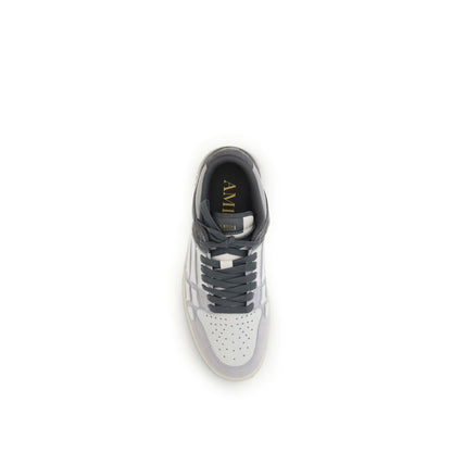 Top view of Amiri Gray Calf Leather Bos Taurus Low Top Sneakers showing grained leather with iconic bone-shaped appliqués.