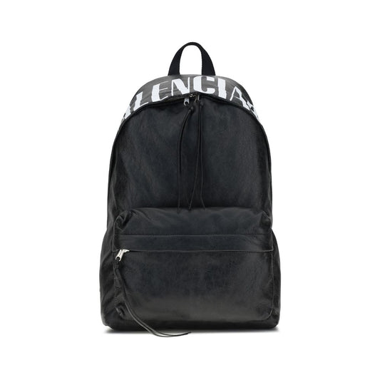 Balenciaga Black Lamb Ovis Aries Aries Backpack with crinkle effect lambskin and printed logo, featuring padded straps and front pocket.