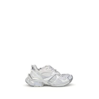 Balenciaga Silver Rubber Athletic Sneakers with worn-in effect and embossed details illustrating grunge aesthetic.