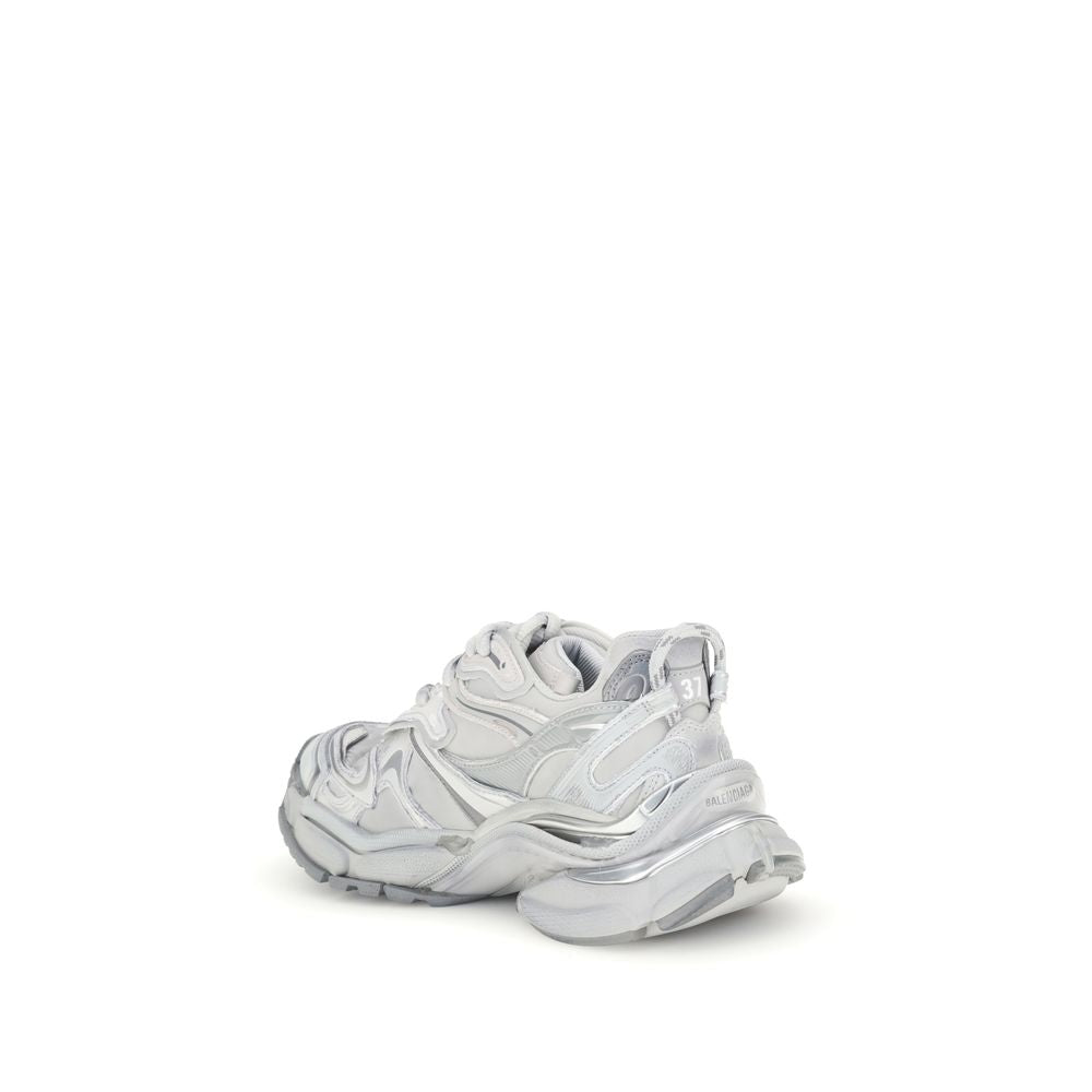 Balenciaga Silver Rubber Athletic Sneakers with worn-in effect, featuring embossed details and signature logos on back and tongue.