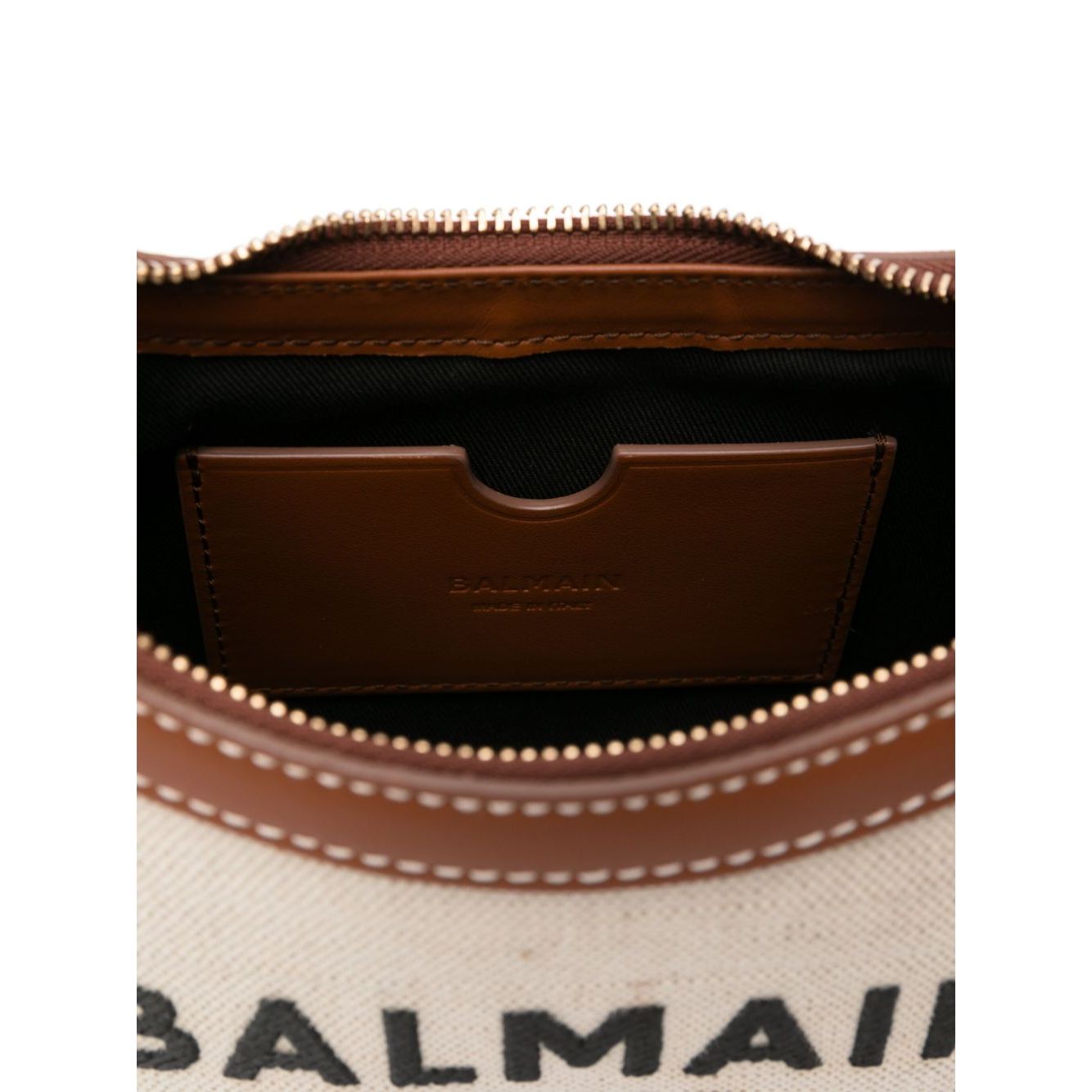 Interior view of Balmain B-Army canvas shoulder bag, featuring beige top zip and main compartment with leather pocket detail.