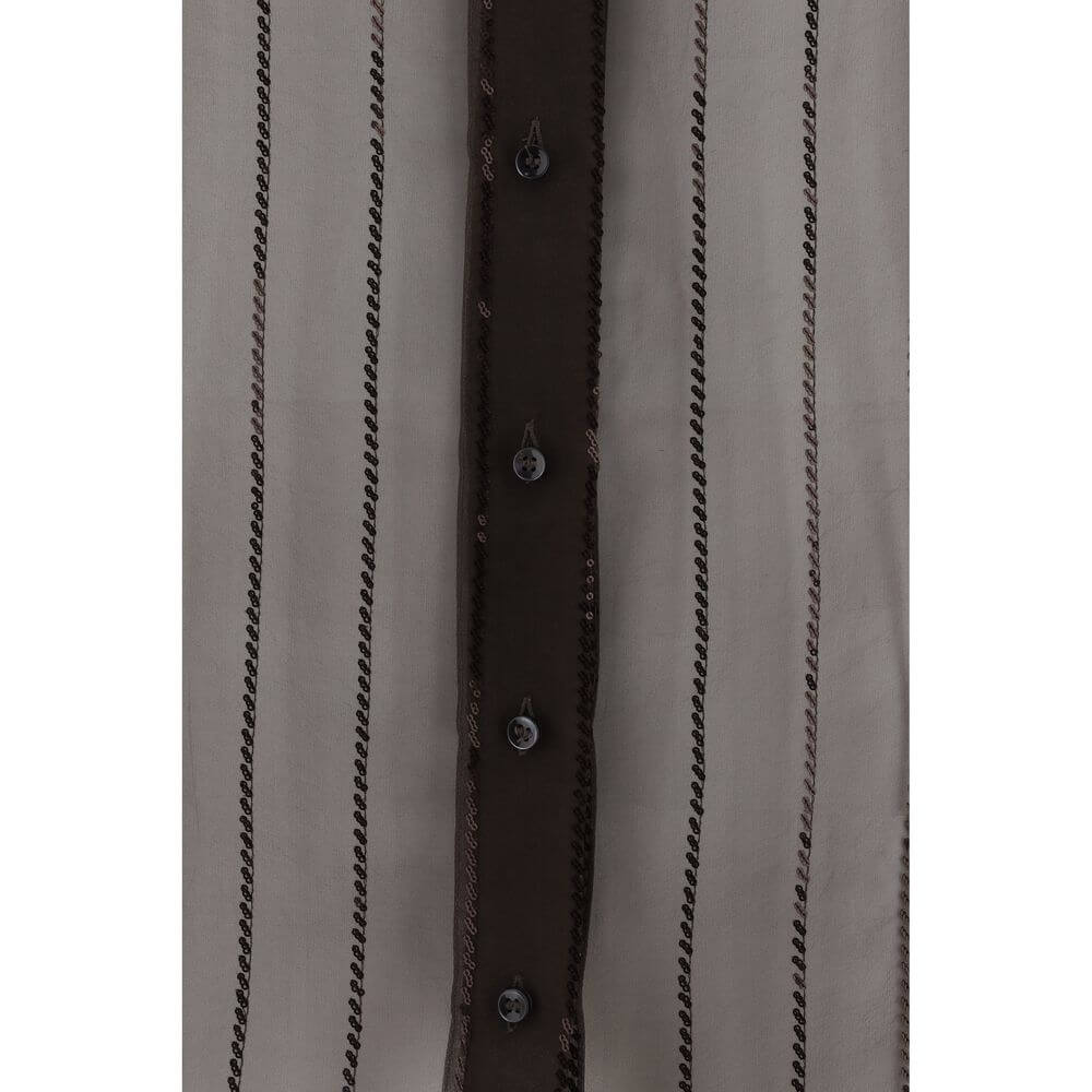 Close-up of Brunello Cucinelli Brown Silk Blouse with sequin embellishments and button closure, showcasing elegant and sophisticated design.