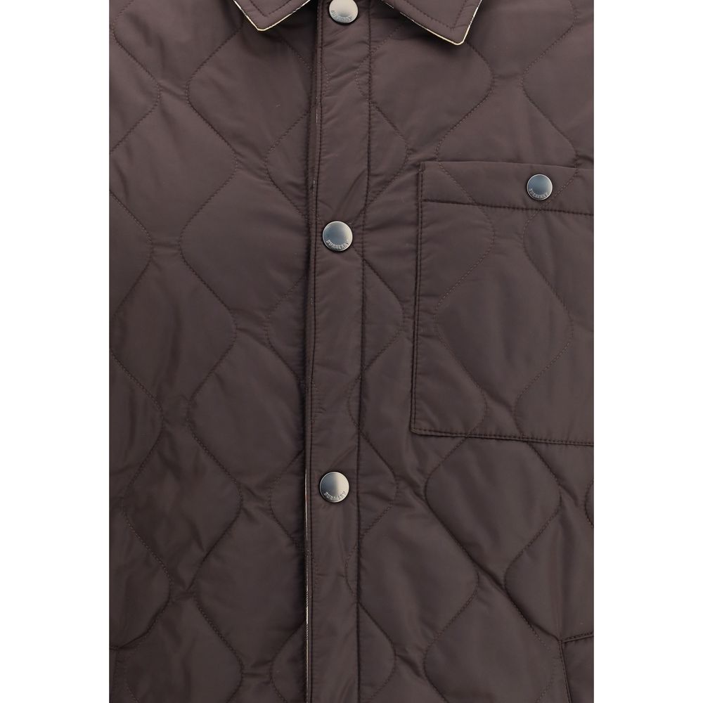 Close-up view of Burberry Brown Polyamide Coat showing quilted design, snap button closure, and chest pocket.