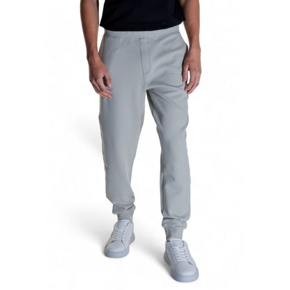 Calvin Klein Gray Cotton Joggers (Workout Pants) shown worn by a person, highlighting modern design, comfort, and versatility.
