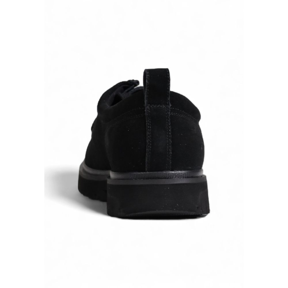 Rear view of Calvin Klein Jeans Black Suede Leather Oxfords And Derbies showcasing the durable ridged sole and stitching details.