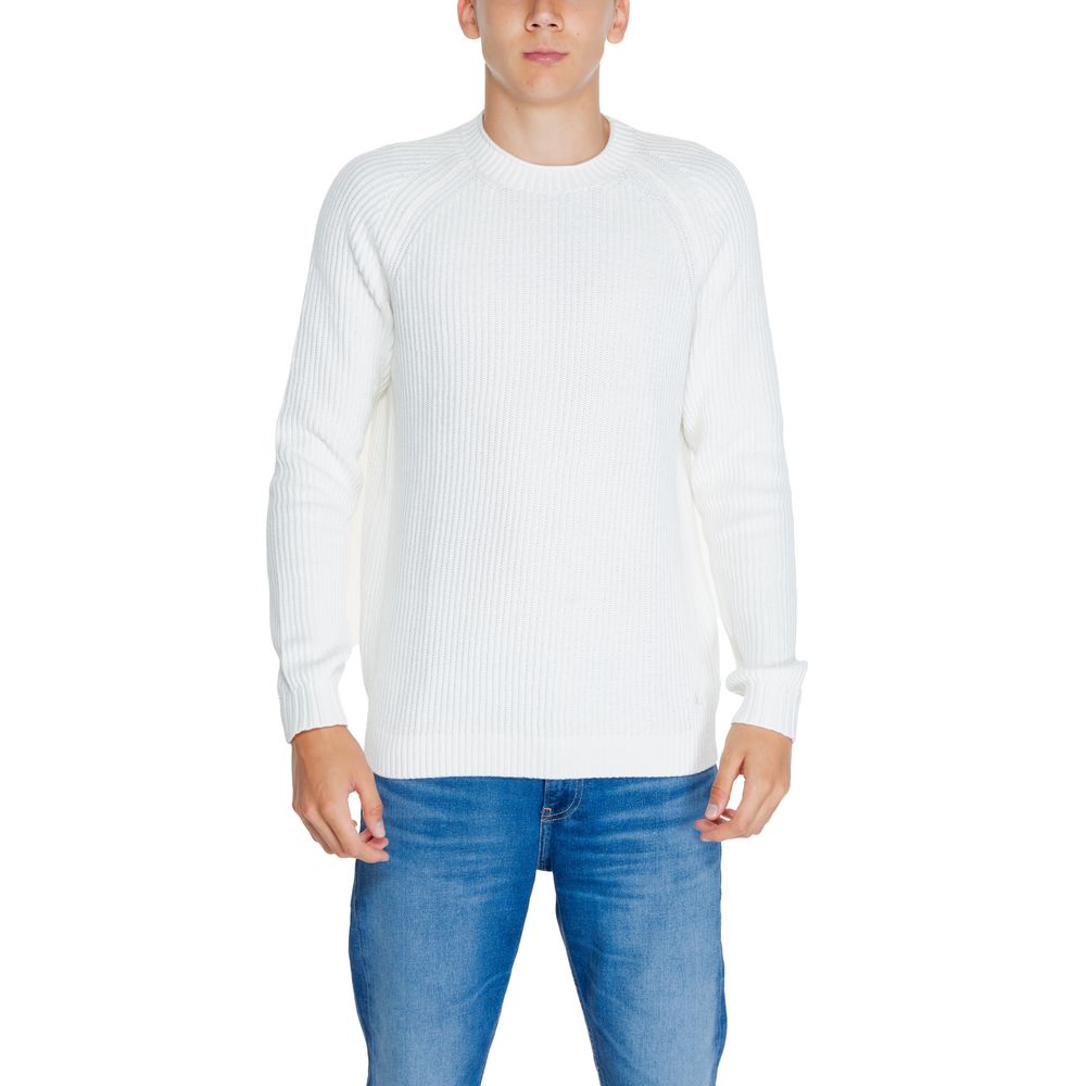 Model wearing Calvin Klein Jeans White Organic Cotton Sweatshirt with ribbed knit design and raglan sleeves for style and comfort.