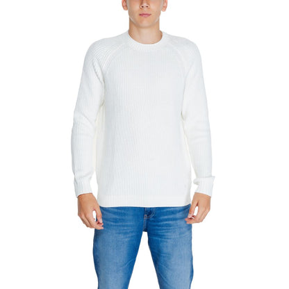 Model wearing Calvin Klein Jeans White Organic Cotton Sweatshirt with ribbed knit design and raglan sleeves for style and comfort.
