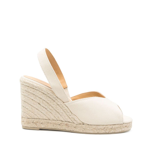 Castañer Castaner Flat shoes Ivory with braided raffia wedge heel, elastic slingback, and peep toe. Heel height: 3.5 inches.