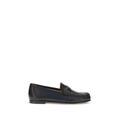 Chloé Black Calf Leather Bos Taurus Slip-On Loafers with gold chain accent on white background