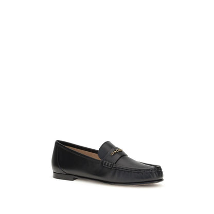 Chloé Black Calf Leather Bos Taurus Slip-On Loafers with gold chain detail and elegant silhouette.